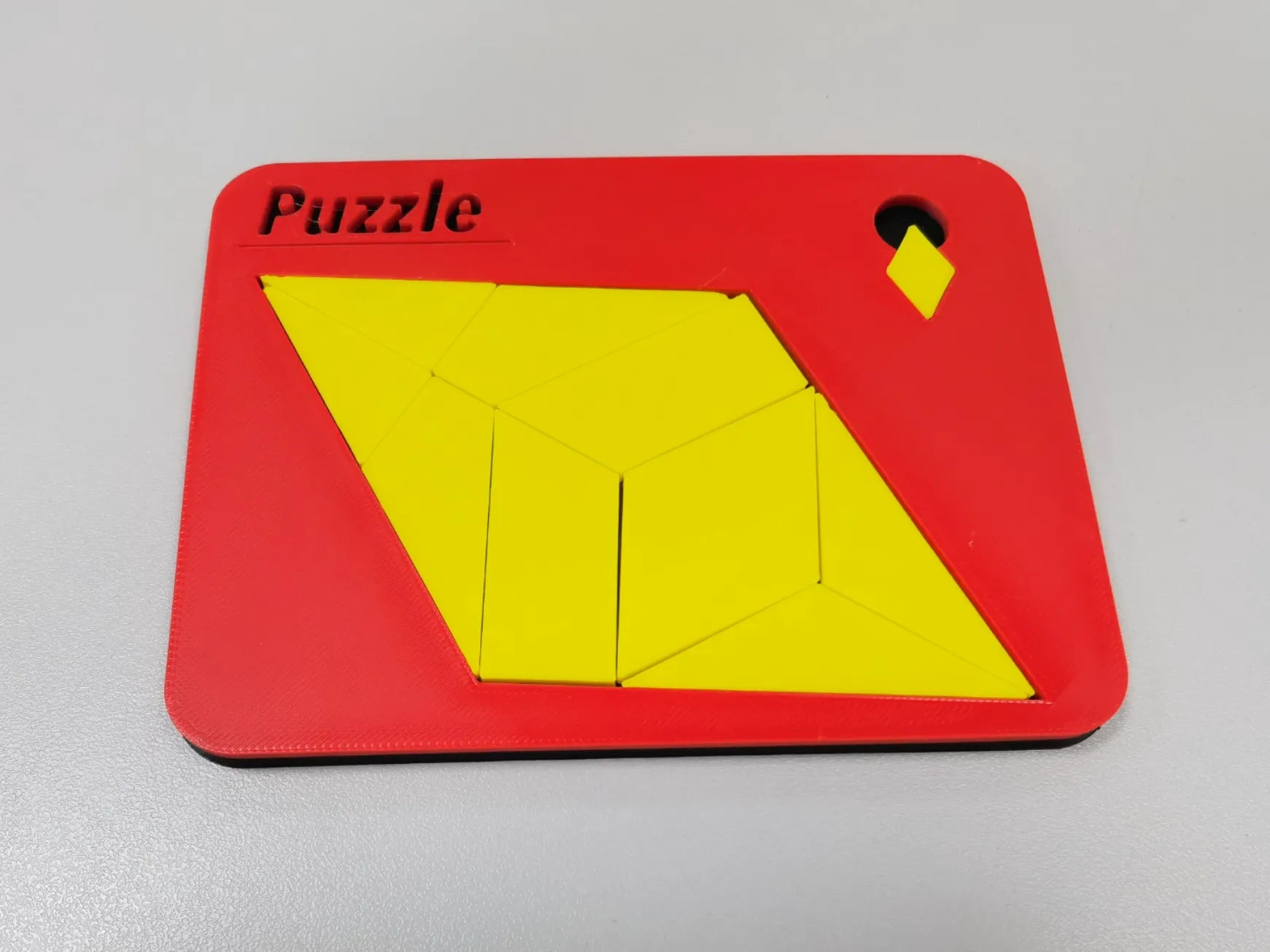 Diamond shape puzzle. Place the small diamond into the seemingly impossible diamond, diamond puzzle.