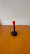 Mini sping-loaded desktop punching bag fidget
